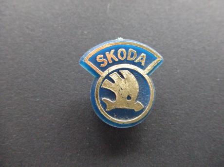 Skoda logo.blauw-goudkleurig